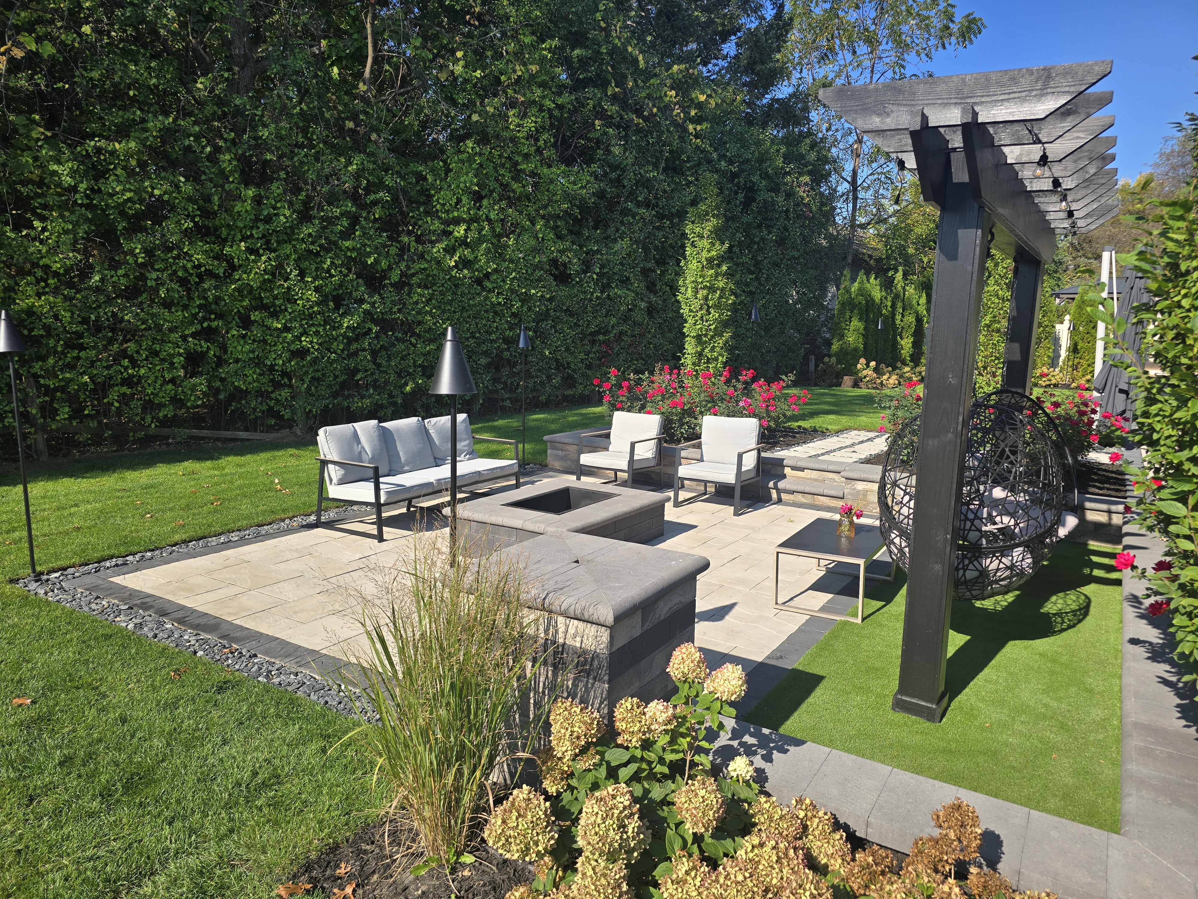 Outdoor living space with fire pit and pergola