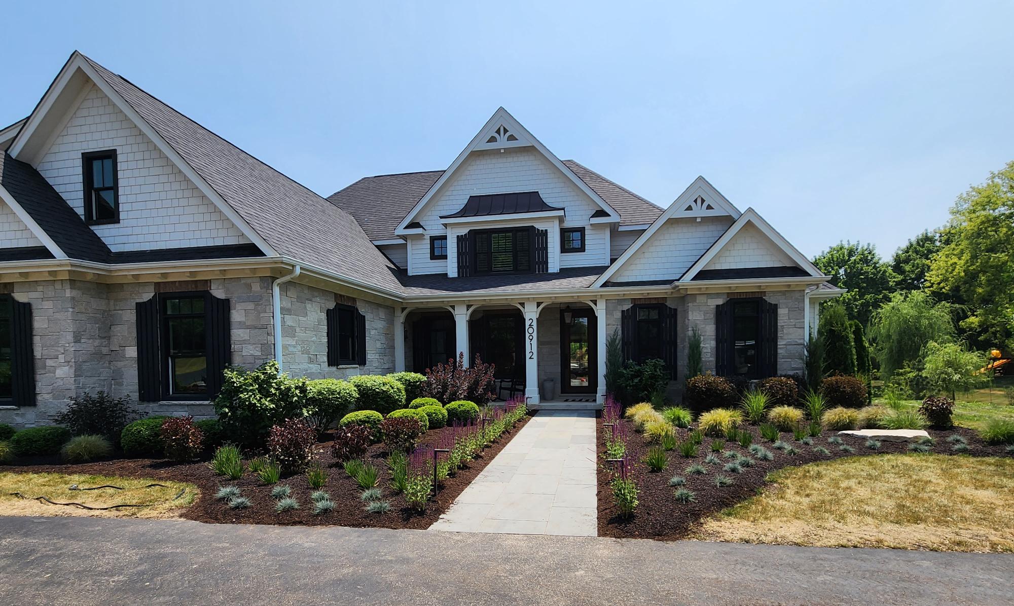 Estate front landscaping with paver walkway