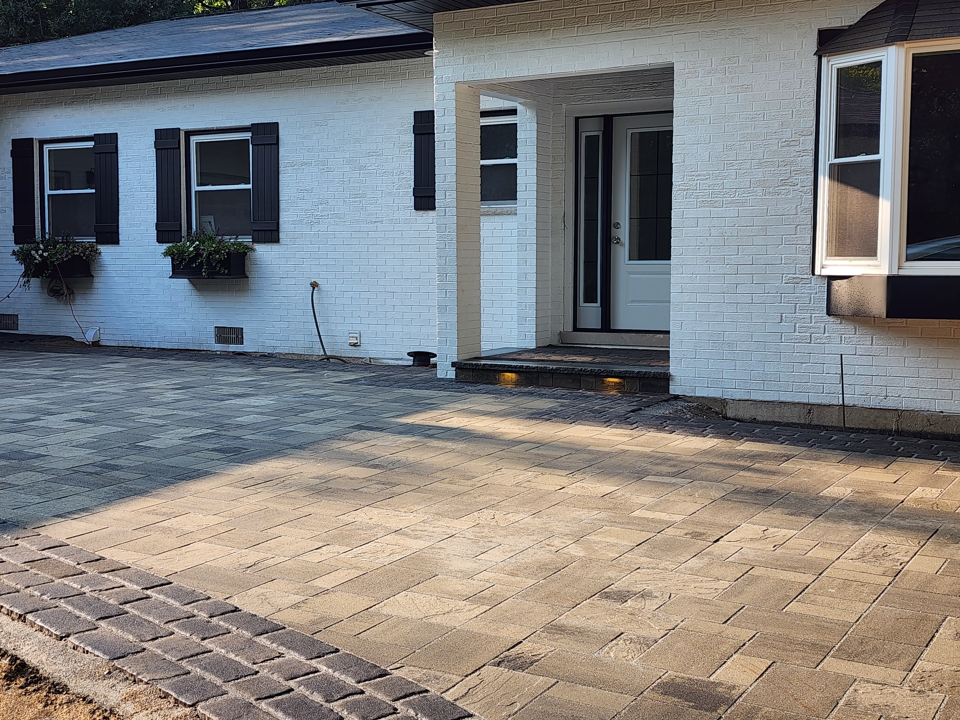 Paver patio with integrated lighting